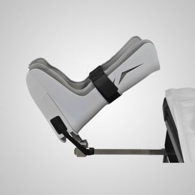 GStirrup boot mounted to an exam table over the existing foot rest.